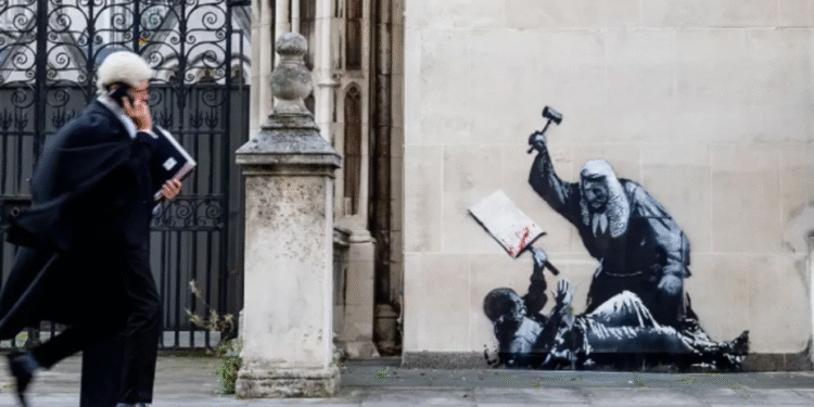 Court Staff Cover Banksy Artwork of Judge Striking Protester on London’s Royal Courts of Justice