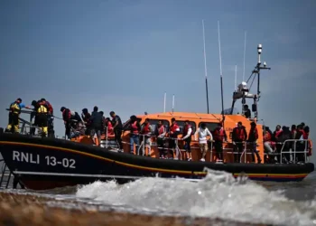 Channel Crossings Surge: Over 1,000 People Arrive in the UK in Small Boats in a Single Day Published: 21 September '2025. the English Chronicle Desk. English Chronicle Online More than 1,000 people made the perilous journey across the English Channel in small boats on Friday, marking a dramatic resumption in migrant crossings after a week-long pause. According to official Home Office figures, 13 separate vessels carried a total of 1,072 individuals to the UK, averaging more than 80 people per boat. This figure is the third time this year that daily arrivals have exceeded the 1,000 mark and contributes to an unprecedented annual total of 32,103 migrants reaching the country via the Channel. The surge comes after eight consecutive days with no recorded arrivals in Dover, Kent, largely due to adverse weather and turbulent sea conditions that had temporarily slowed the flow of migrants. Experts note that the lull had raised hopes that stricter border measures and improved deterrent strategies might be having an effect, but Friday’s numbers underscore the enduring challenges faced by UK authorities in controlling maritime migration. The Channel crossing, which spans roughly 21 miles at its narrowest point, has become a major flashpoint in UK immigration policy. Each boat carries individuals fleeing conflict, economic hardship, or persecution, many of whom take extraordinary risks in often unseaworthy vessels. In recent years, crossings have escalated as traffickers exploit both the demand for asylum and the limitations of coastal patrol capabilities. Friday’s arrivals, the largest single-day total since early September, serve as a stark reminder of the ongoing humanitarian and security dilemmas confronting the government. In response, the UK government has sought to implement a “one in, one out” plan in collaboration with France, designed to deter would-be asylum seekers by ensuring that those arriving illegally may be swiftly returned to the continent. Under the scheme, individuals who cross the Channel without authorization can be detained immediately and, within approximately two weeks, arrangements can be made with French authorities for their return. For every person returned to France, the plan allows for one individual with a credible asylum claim in the UK to enter, establishing a controlled exchange system. Home Office sources confirmed that three people have already been removed from the UK under this new protocol. On Friday alone, an Iranian national was deported following the removal of an Eritrean man who had lost a High Court appeal seeking to block his removal. Earlier, on Thursday, an Indian national was sent back to France under the same arrangement. Officials say these initial removals represent a testing phase of the pilot program, with additional flights planned in the coming week to expand the scheme. Deputy Prime Minister David Lammy praised the initiative, stating that the returns provide an “immediate deterrent” to those considering the dangerous Channel crossing. According to government assessments, quick repatriation of migrants is intended to signal that illegal maritime entries will not guarantee asylum in the UK and that risks—both legal and physical—are significant. “We are making it clear that while those with legitimate claims will be assessed fairly, illegal crossings carry serious consequences,” a Home Office spokesperson said. However, critics have raised questions about the effectiveness and fairness of the policy. Conservative shadow home secretary Chris Philp argued that the current returns had “no deterrent effect whatsoever” and described the number of individuals deported so far as “pathetic” compared to the scale of arrivals. Opposition figures and human rights advocates warn that the approach risks focusing on punitive measures rather than addressing the root causes of migration, including ongoing conflict, poverty, and human rights violations in the countries of origin. They also caution that overcrowded small boats and rushed deportations could exacerbate humanitarian risks, particularly for vulnerable groups such as children and families. The Channel crossing has long been emblematic of the complex intersection of humanitarian responsibility, border security, and international cooperation. Each arrival highlights not only the determination of migrants seeking safety or economic opportunity but also the ongoing logistical, legal, and diplomatic challenges faced by the UK. For authorities, monitoring and managing such a high volume of arrivals in a short span requires coordination among the Coast Guard, local law enforcement, border agencies, and international partners, particularly France. French authorities have played a central role in the “one in, one out” initiative, agreeing to accept returned migrants in exchange for UK recognition of individuals with verified claims. While this cooperation has been described as a step toward managing irregular migration more systematically, logistical hurdles remain. Authorities must ensure that returned migrants are processed humanely and that legitimate asylum claims are respected. For many observers, the key to long-term success lies in balancing deterrence with a fair, transparent, and humanitarian approach to asylum. The humanitarian aspect of the crossings cannot be understated. Many of the individuals arriving in small boats have endured harrowing journeys through multiple countries before reaching the Channel. They often face smuggling networks, exploitative intermediaries, and life-threatening conditions at sea. According to maritime safety organizations, even with relatively calm weather, overcrowded boats are susceptible to capsizing, hypothermia, and other medical emergencies. Local rescue teams frequently respond to distress calls, pulling hundreds of individuals from the water each month, highlighting the ongoing dangers involved in these crossings. On Friday, despite calmer seas that allowed for more successful crossings, emergency responders remained on high alert. Multiple reports from Kent-based authorities indicate that border patrols and search-and-rescue teams worked in coordination with French maritime units to manage the arrivals efficiently. Nevertheless, the scale of the crossings continues to stretch resources, particularly in Dover and surrounding coastal towns, which are increasingly seen as frontline points of entry. The spike in arrivals has reignited debate in Parliament over immigration policy and the UK’s obligations under international law. Proponents of stricter border controls argue that the Channel crossings demonstrate the need for stronger deterrence and more rapid removals, while opponents highlight the ethical and legal imperatives to protect asylum seekers and address the conditions driving migration. Legal experts have noted that the “one in, one out” scheme raises questions regarding due process, particularly when migrants are returned in absentia or before receiving full hearings on their claims. Looking forward, officials anticipate that the volume of crossings may fluctuate with weather conditions and enforcement measures. Historically, numbers have risen sharply during periods of calm seas and favorable weather, while storms and rough waters temporarily reduce arrivals. The Home Office continues to emphasize the dual focus on securing the border and ensuring safety at sea, with ministers asserting that the pilot program in partnership with France will expand in the coming months to address the unprecedented levels of migration. The events of Friday underscore the ongoing tension between policy, enforcement, and humanitarian responsibility. With over 1,000 people risking life and limb to cross the Channel in a single day, the UK faces a complex challenge: ensuring border security while simultaneously upholding international obligations to protect vulnerable populations. As ministers, local authorities, and international partners grapple with these issues, the Channel crossings remain a vivid illustration of the human stories behind immigration statistics—stories marked by resilience, desperation, and hope. In conclusion, the record number of arrivals on Friday serves as a sobering reminder of both the determination of those seeking a new life and the scale of the challenge facing UK authorities. The “one in, one out” plan represents a bold attempt at managing the crisis, but its ultimate efficacy, fairness, and humanitarian impact will continue to be scrutinized as the situation evolves. The coming weeks and months are likely to reveal whether the strategy can effectively deter dangerous crossings, uphold the rights of asylum seekers, and maintain the delicate balance between security and compassion.