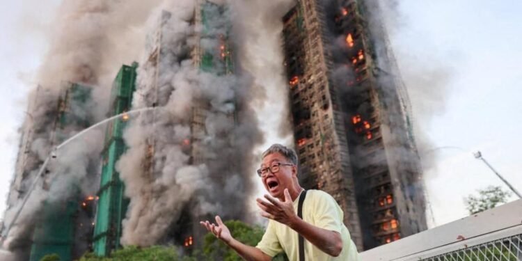 Families wait in agony for missing after HK tower blaze