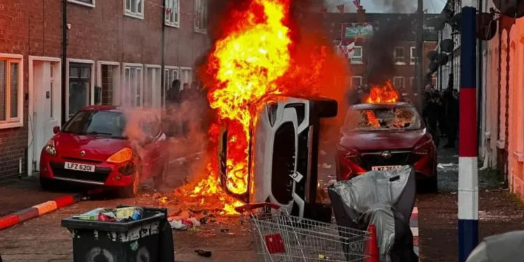 Belfast violence homes set on fire skin colour targeting