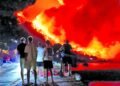 Wildfires rage across Europe as hundreds arrested in France