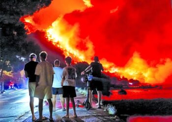Wildfires rage across Europe as hundreds arrested in France
