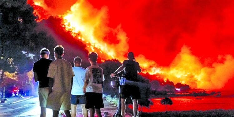 Wildfires rage across Europe as hundreds arrested in France
